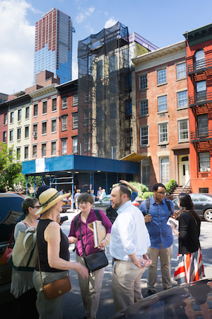 Councilmember Corey Johnson (fourth from left) speaks with Fern Luskin (in hat) and Julie Finch (wearing glasses). In the background, draped in netting, is the Hopper-Gibbons House. Photo by Daniel Kwak.