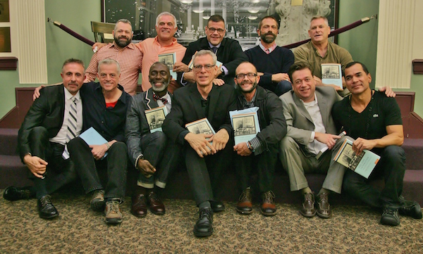 Perry N. Halkitis, at bottom left, joined some of the men he interviewed for “The AIDS Generation: Stories of Survival and Resilience.” Photo by Sam Spokony.
