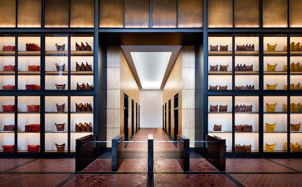First Tenant Fills Hudson Yards Tower 4 A “product library” of ceiling-high shelves filled with handbags, the company’s signature product, fittingly frames the entrance to the Coach offices. Photo by Steve Freihon for Related-Oxford.