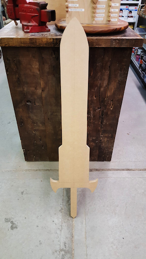 Sometimes patrons appear before Midtown Lumber craftsmen with unusual requests, such as this anime-inspired sword cut. Photo courtesy Midtown Lumber Mart.