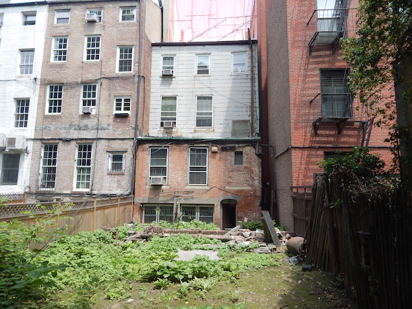 A back view of 404 W. 20th St. Current plans for the property would build out to match the neighboring building on the right (402 W. 20th St.). Photo by Sean Egan.