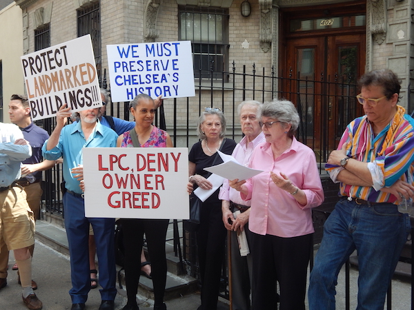 At the rally, Mary Swartz of Save Chelsea urged “the LPC [to] reject the wholly inappropriate plans” for 404 W. 20th St., and read a statement of opposition from State Senator Brad Hoylman. Photo by Sean Egan.