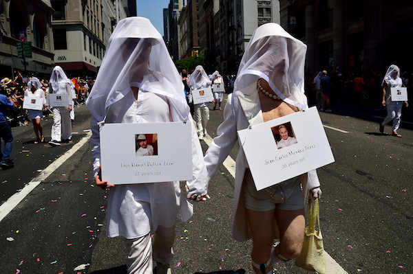 A group of 49 people organized by performance artist Tigger-James Ferguson bore silent witness to those killed in the Pulse nightclub in Orlando. | DONNA ACETO 