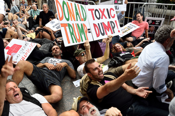 Taking Protest Right to Trump's Front Door 2 Protesters lay down in front of Trump Tower. | DONNA ACETO