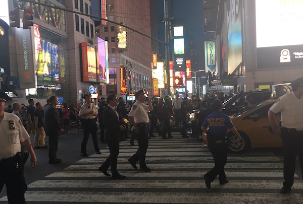 On the evening of July 8, police officials in Times Square work to keep control of a protest that resulted in more than 40 arrests. | LAUREN VESPOLI 
