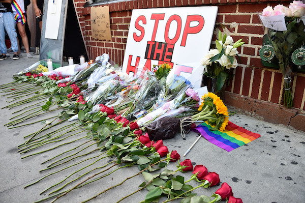 Flowers and pleas to end the hate outside the Stonewall Inn in the West Village. | DONNA ACETO 