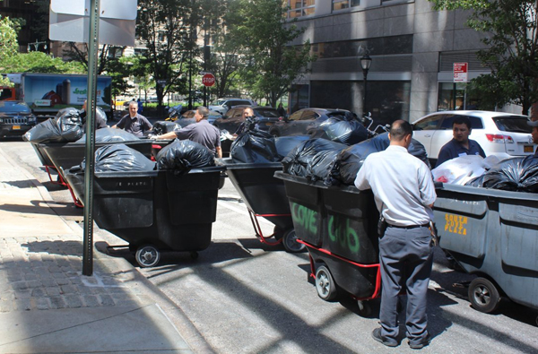 Sanitation salvation? Battery Park City may hold the key to conquering Downtown’s garbage glut 3 Rather than stacking bags of garbage at the curb every other day to sit overnight awaiting pickup and attracting rats, most residential buildings in Battery Park City bring each day’s worth of garbage to central compactors in pushcarts, so the trash never even touches the neighborhood’s sidewalks.