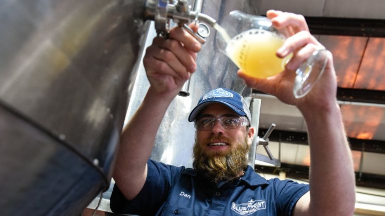 Head Brewmaster Dan Jansen pours a taste of a new beer in development at the Blue Point Brewery in Patchogue on April 7, 2016.
