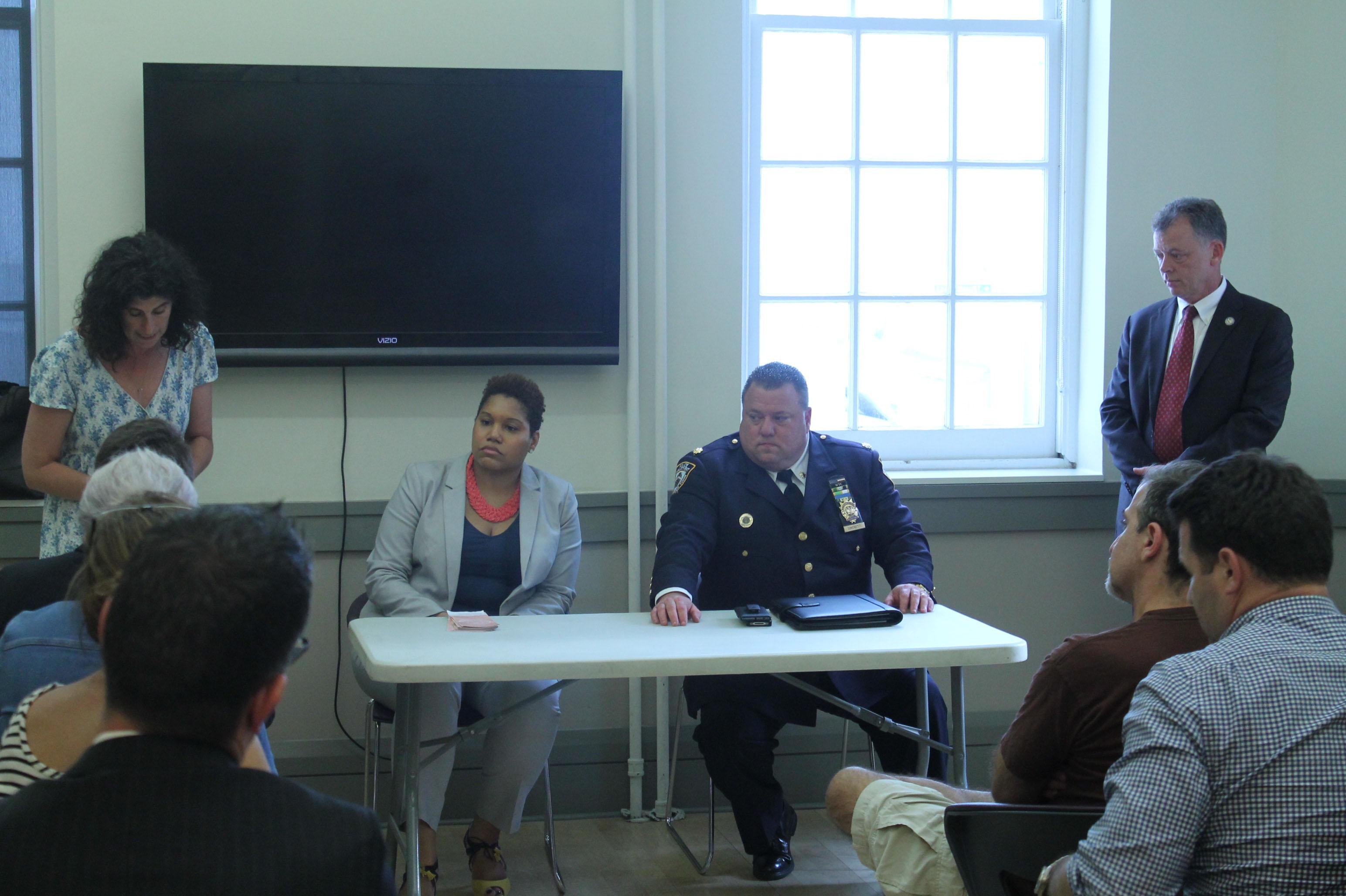 From left, P.S. 41 parent Heather Campbell; Raniece Medley, C.C.R.B. outreach director; and Deputy Inspector Joseph Simonetti and Detective Jimmy Alberici, of the Sixth Precinct. Photo by Michael Ossorguine