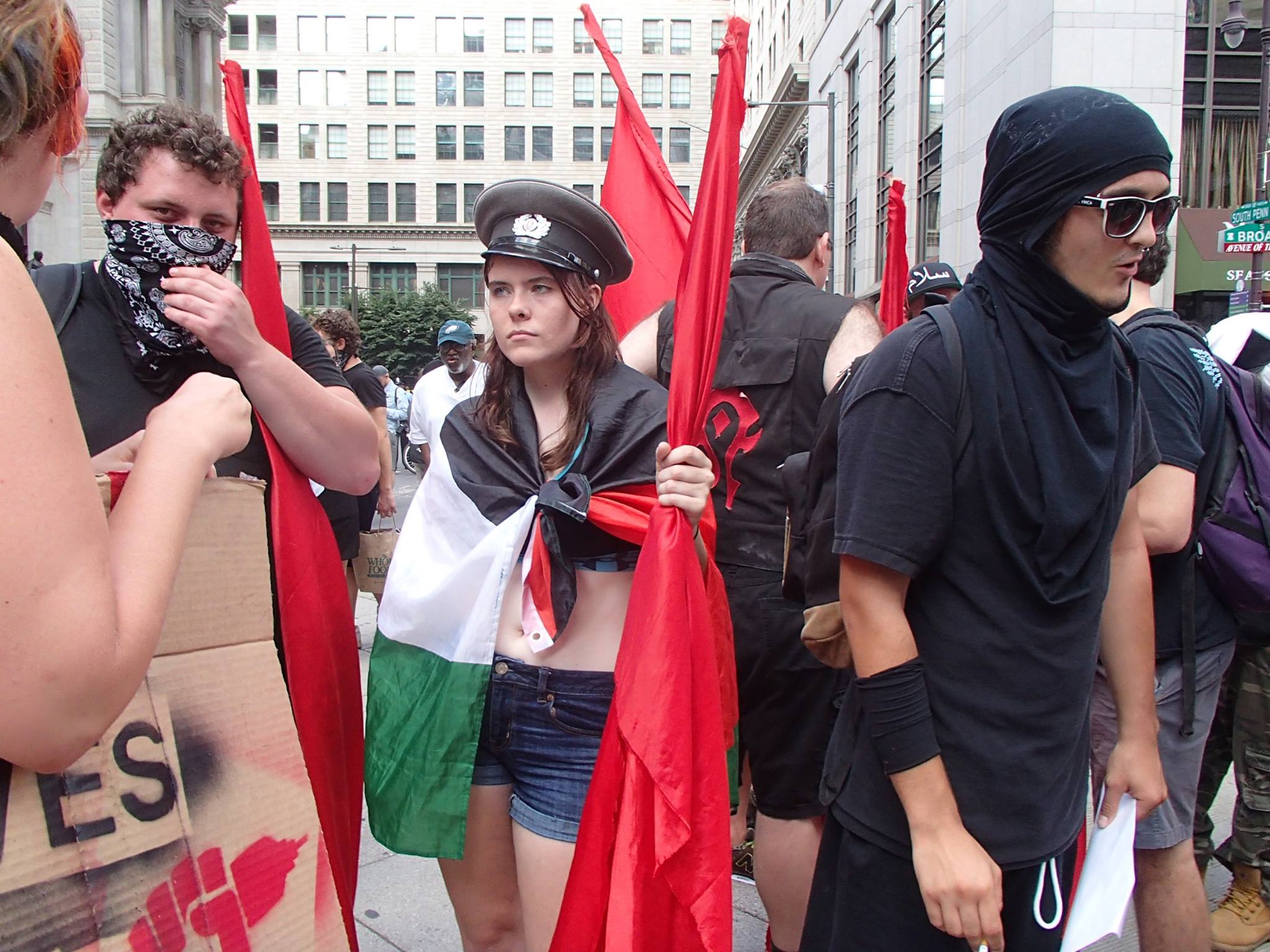 From the seats to the streets: Reflections on the D.N.C. 7 Protesters let their flags fly.