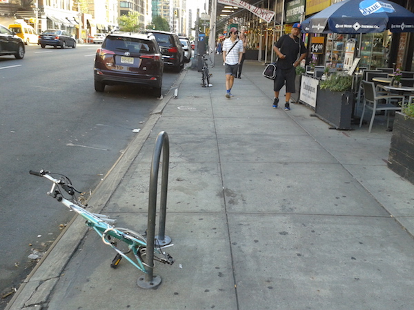 Derelict Bikes Are Unwelcome Sidewalk Staples 1 A derelict bike on Seventh Ave., btw. W. 21st & W. 22nd Sts., on July 25. The next day, it was tagged for removal. Photo by Scott Stiffler.
