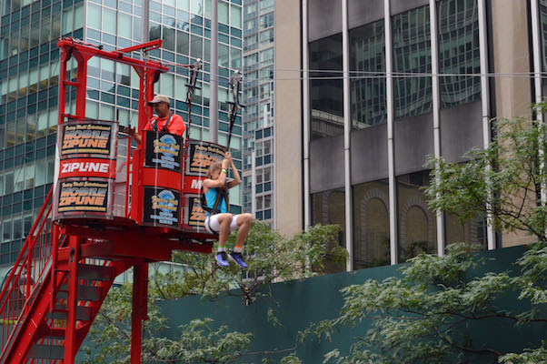 A rider begins her zipline adventure at Park Avenue and East 53rd Street. | JACKSON CHEN 