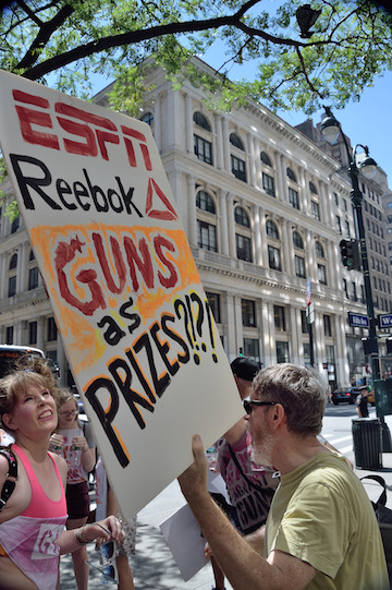 Protesters also noted the role of the Games' sponsor Reebok and broadcaster ESPN. | DONNA ACETO