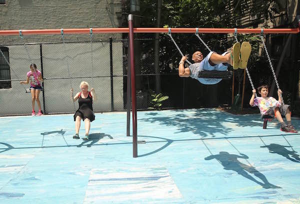Renovations Revitalize Ramon Aponte Park 3 Community members enjoy the swings in newly-renovated Ramon Aponte Park. Photo by William Alatriste/NYC City Council.