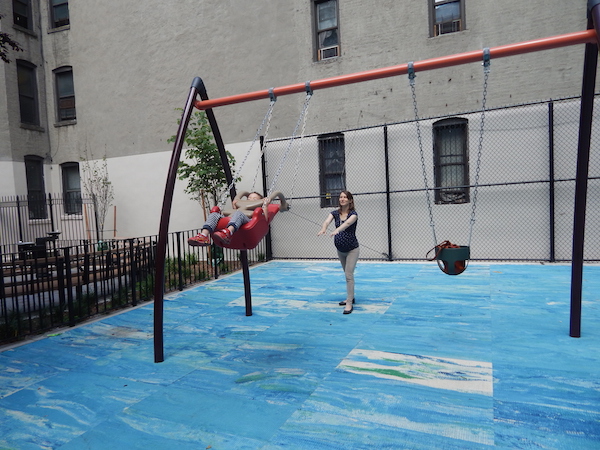 Kyra Weaver pushes her son Ray on the swing set at Ramon Aponte Park. Photo by Jane Argodale.