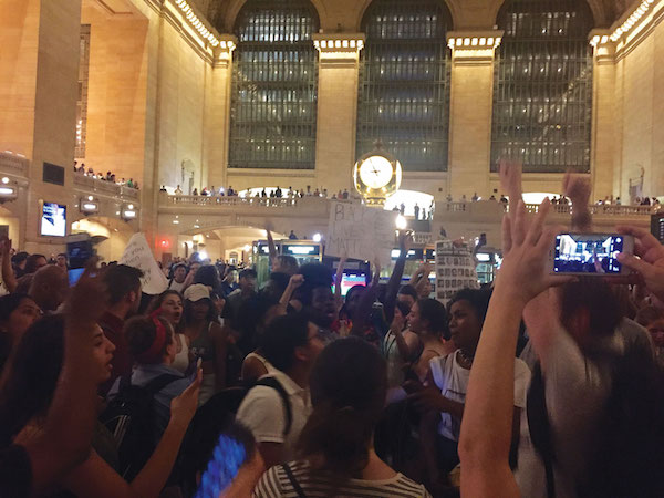 Black Lives Matter Protesters March Throughout the Weekend 6 Inside Grand Central, protestors gathered under the clock tower before holding a moment of silence for victims of police shootings. Photo by Lauren Vespoli.