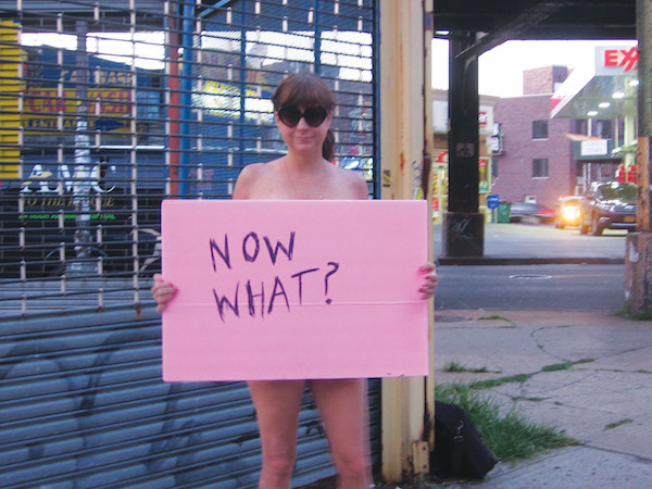 Sign of her times: Rev. Jen ponders life away from the Lower East Side. Photo by John Foster.