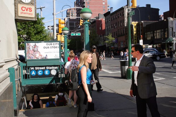 The Canarsie Line currently serves 50,000 daily riders in Manhattan alone, according to the MTA. Seen here, straphangers at the entrance to the Eighth Ave. L train stop on W. 14th St. Photo by Yannic Rack.