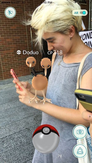 Pokémon Go, From the High Line to the Hudson 2 Reporter Jane Argodale playing Pokémon Go on the High Line, with a Doduo perched on her arm. Photo by Michael Sugarman.