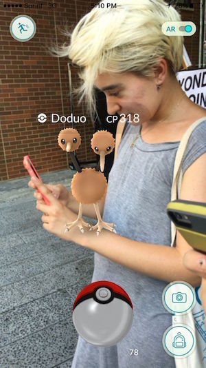 Reporter Jane Argodale playing Pokémon Go on the High Line, with a Doduo perched on her arm. Photo by Michael Sugarman.