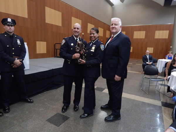 Awards Night Honors 10th Precinct’s Finest 2 Center group, L to R: Captain Paul Lanot, Inspector Michele Irizarry, and Larry O’Neill, Director of Security for Penn South. Photo by Jane Argodale.