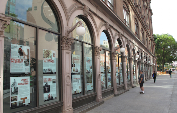 Placards ballyhoo Bowery as birthplace, nexus 1 A display of “Windows on the Bowery” posters, in the western colonnade windows of Cooper Union's Foundation Building. Photo by David Mulkins.