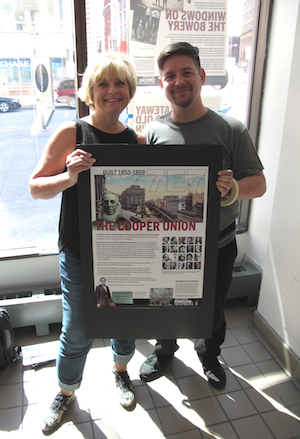 “Windows” Art Director Mindy Lang and Tony Roman of J.A. Digital, who installed the posters at Cooper Union. Photo by David Mulkins.