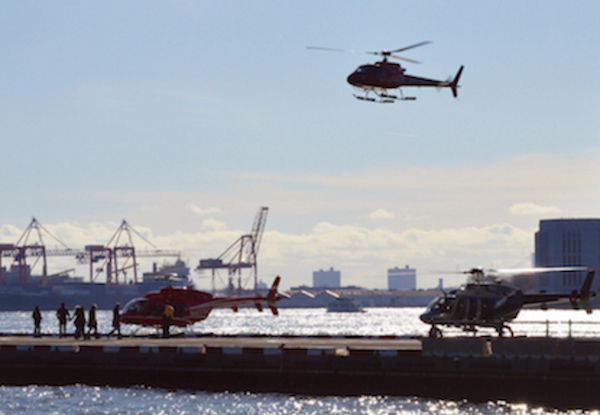 Prior to this year’s deal to reduce helicopter tours by one half by next year, on a clear summer day more than 300 helicopter tours might leave Pier 6 Downtown for trips up and down the Hudson River. | JACKSON CHEN 