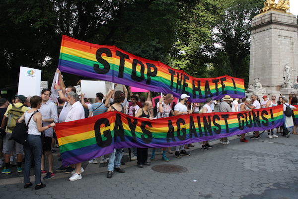 Guns, Platform Draw Gays to Trump Tower During GOP Convention 1 Banners carried by protesters who traveled from Trump Tower on Fifth Avenue to Trump International Hotel at Columbus Circle in a July 18 demonstration. | MICHAEL SHIREY