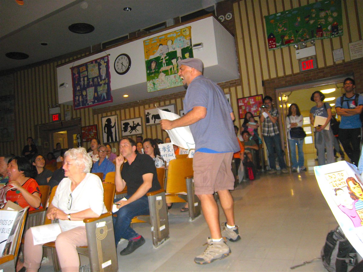 Jamie Rogers is elected chairperson of C.B. 3 amid cries for L.E.S. / C’town rezoning support 3 A protester disrupted the meeting while carrying a sign reading, “Sell Out,” with a photo of Mayor de Blasio and a developer on it. During one tense moment, he held the sign over Gigi Li’s head.