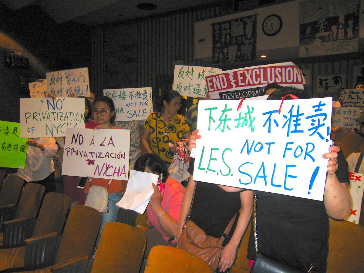 Members of the Coalition to Protect Chinatown and the Lower East Side made their demands known with signs and vocal outbursts.