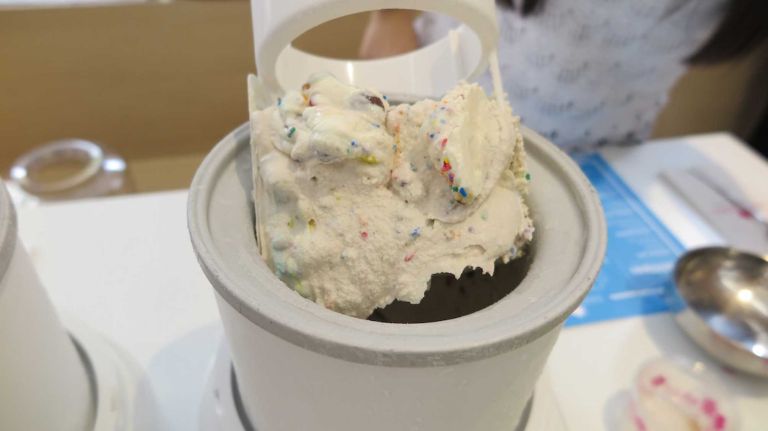 While yes, this is a DIY ice cream parlor, there are staffers who help with some steps, like this one. 