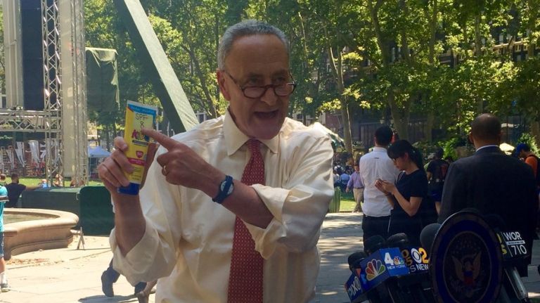 Sen. Chuck Schumer says a bottle of sunscreen that says SPF 50 only delivers SPF 8 at a press conference in Bryant Park on Wednesday, July 20, 2016. 