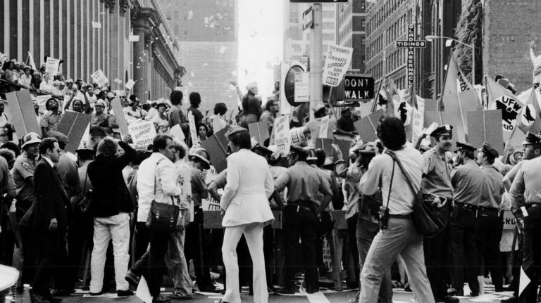 Crowds of protesters, police and press gather outside of Madison Square Garden for demonstrations before the start of the Democratic National Convention on July 12, 1976.