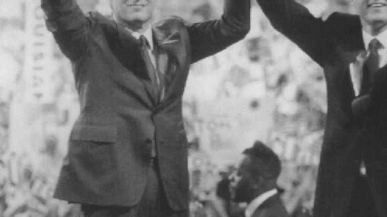 Al Gore and Bill Clinton hold up their hands in victory at the conclusion of the Democratic National Convention on July 16, 1992. 