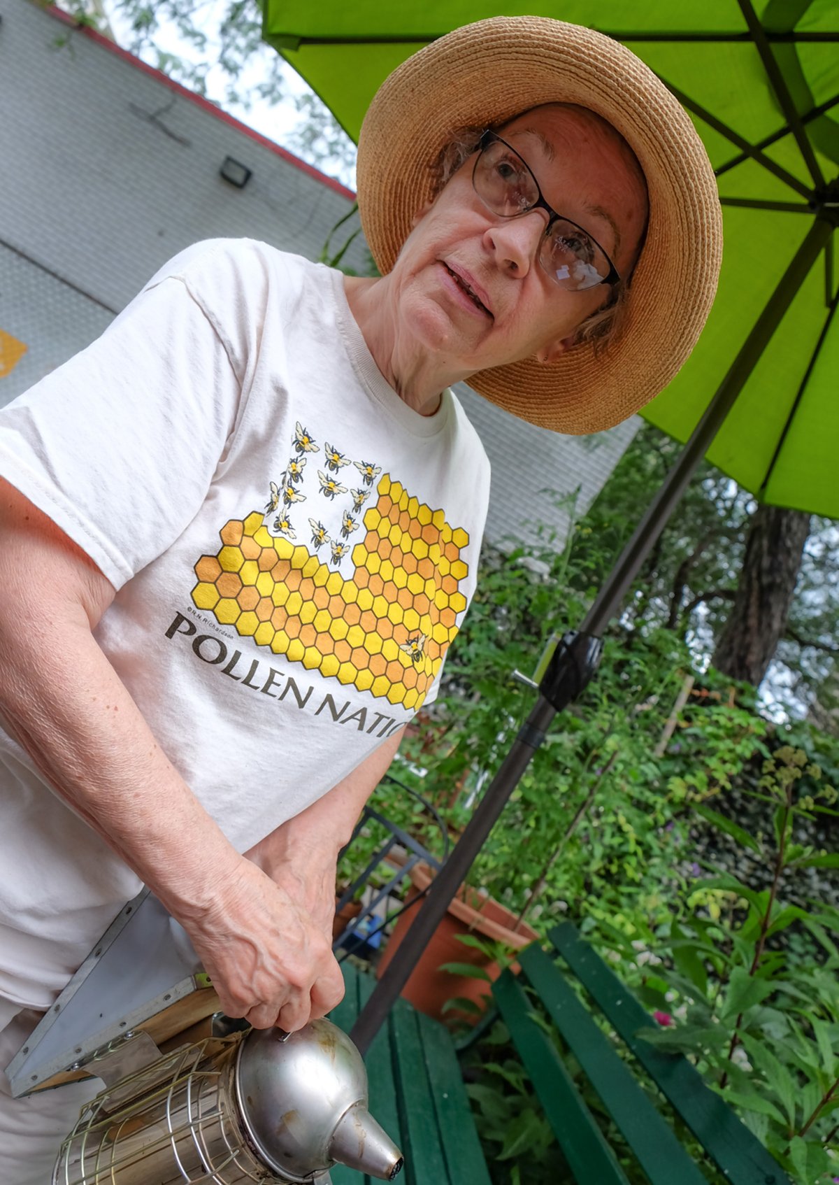 Beekeeper Sara Jones about to put away the smudge pot, the smoke from which disorients the bees, so that they don't sting.