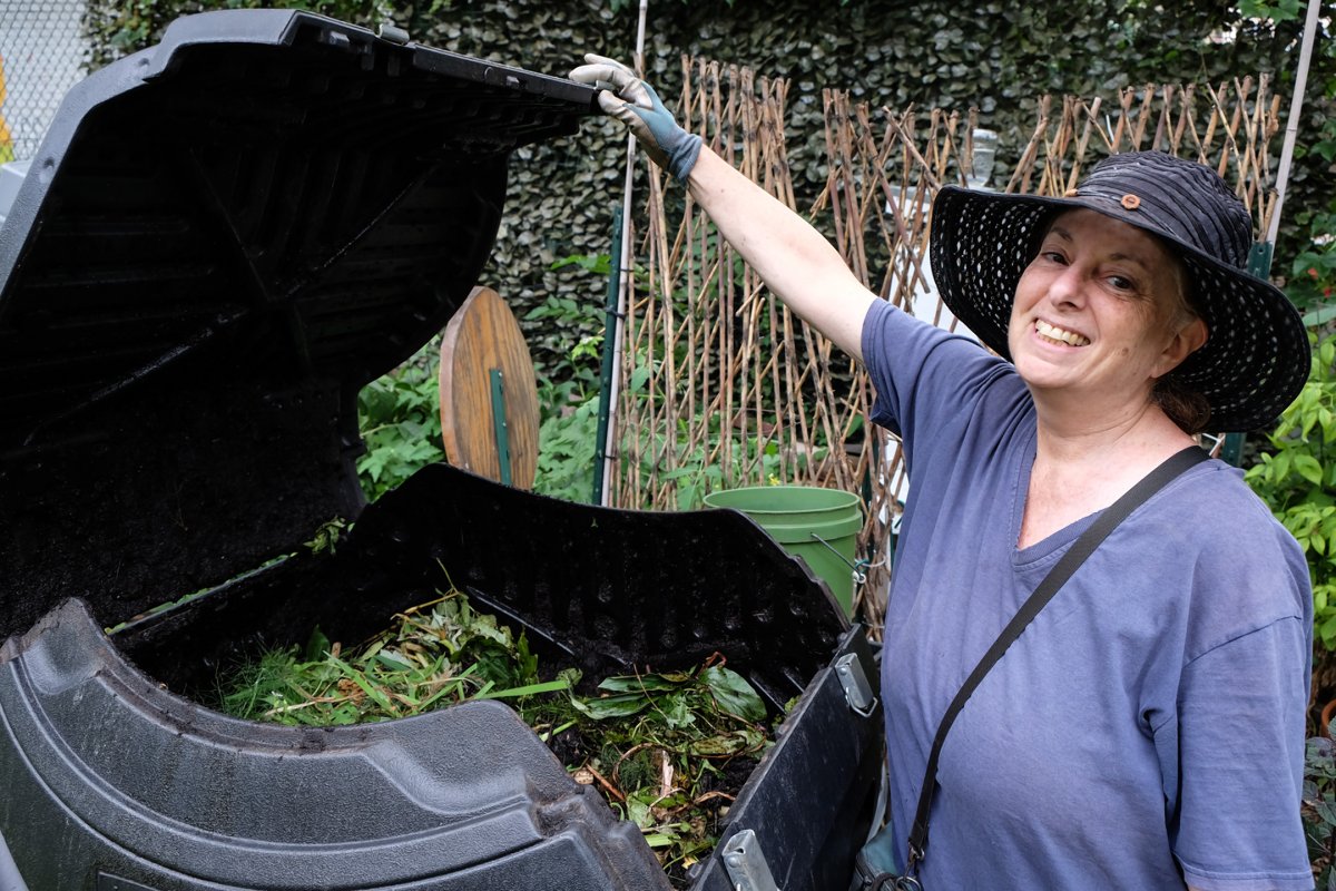 Barbara Cahn shows off the compost pile just for the  garden's clippings and other organic matter.