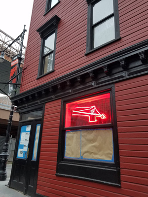 Photo by Janel Bladow Signs of life at the Bridge Cafe when its iconic neon sign was lit for the first time since Hurricane Sandy.