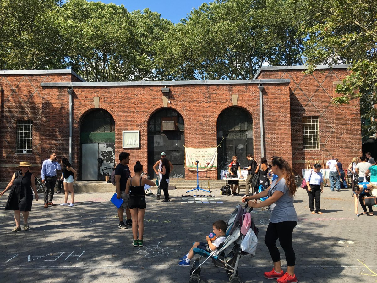 Advocates gathered outside the Stanton St. building in S.D.R. Park this past July during one of three workshops held over the summer to brainstorm about ideas for the building’s reuse. Villager file photo