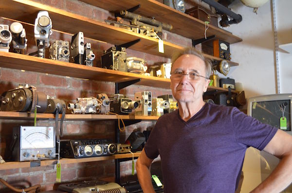 Tekserve co-founder Dick Demenus standing in front of his collection. Photo by Alex Ellefson.
