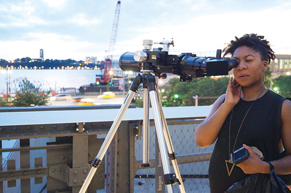 A visitor to the High Line stops to stargaze. Photo by Nicole Javorsky.