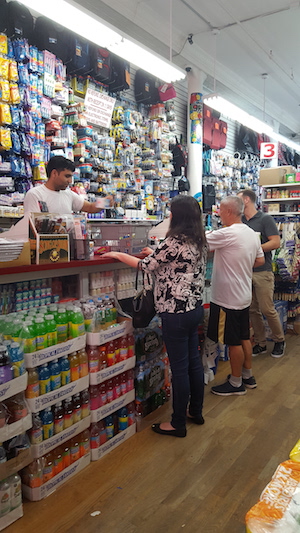 Danish Cheema, who has worked at the store for a few months, rings up customers.