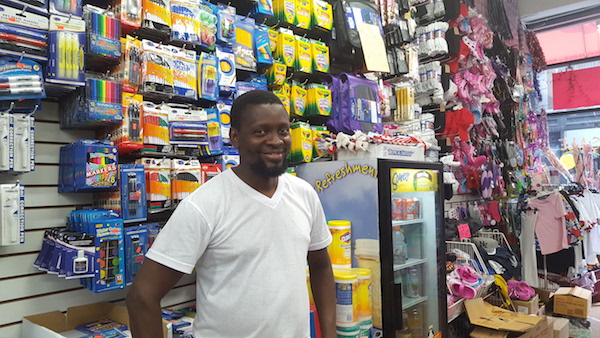 General manager Mamadou Diaman in front of the back-to-school display. Photo by Dusica Sue Malesevic.