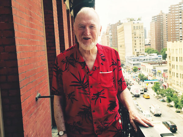 Gerald Busby, on his fifth floor balcony overlooking W. 23rd St. Photo by Puma Perl.