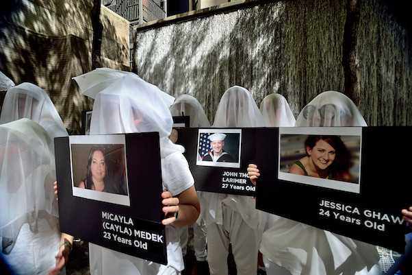 Veiled protesters outside BlackRock’s East 52nd Street headquarters. | DONNA ACETO 