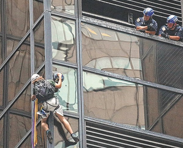 Stephen Rogata, at around the eighth floor of Trump Tower, turns the corner from an east-facing wall to a south-facing one after police cut through ventilation grates above him. | JEFFERSON SIEGEL