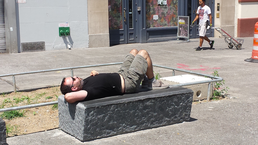 Remember ‘The Alamo’? ... Well, it’s coming back! 5 Lounging on a new bench of hewn stone in the Cooper Square part of the plaza project.