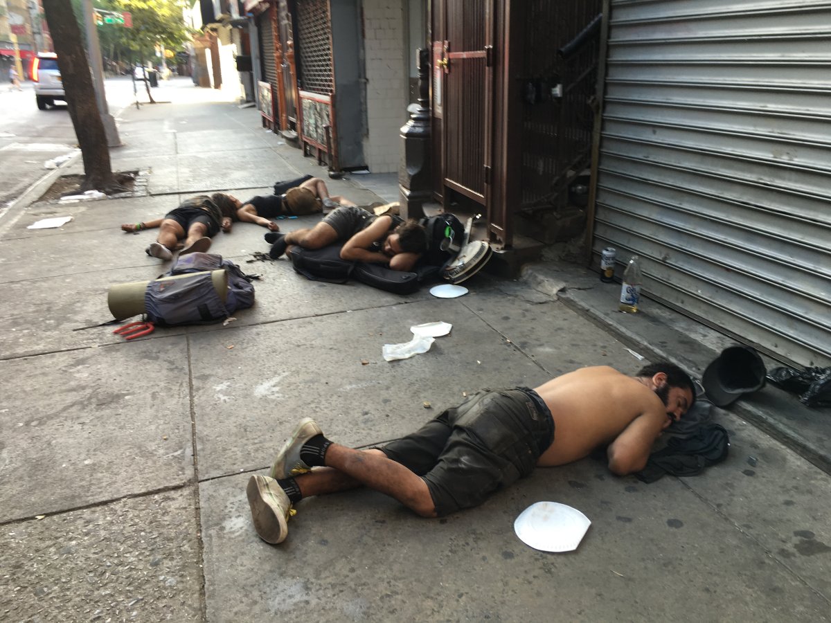 Young crusty travelers out cold on St. Mark’s Place on a Sunday morning last month. Photo by Roberta Bayley