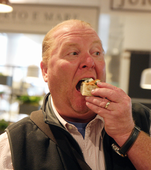 Mangia! Eataly preps for Aug. 11 opening at 4 WTC 2 Photo by Milo Hess Celebrity chef and Eataly partner Mario Batali couldn't resist snarfing down a snack at the high-end food mall's preview event on Aug. 2.
