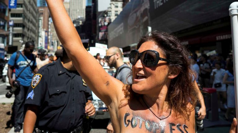 Kasyo Perrier, an organizer of the event, chants as she marches during the GoTopless Pride Parade on Sunday, Aug. 28, 2016, in Manhattan. The GoTopless organization is holding this rally, one of at least 60 nationally and worldwide, to promote topless rights for women.
